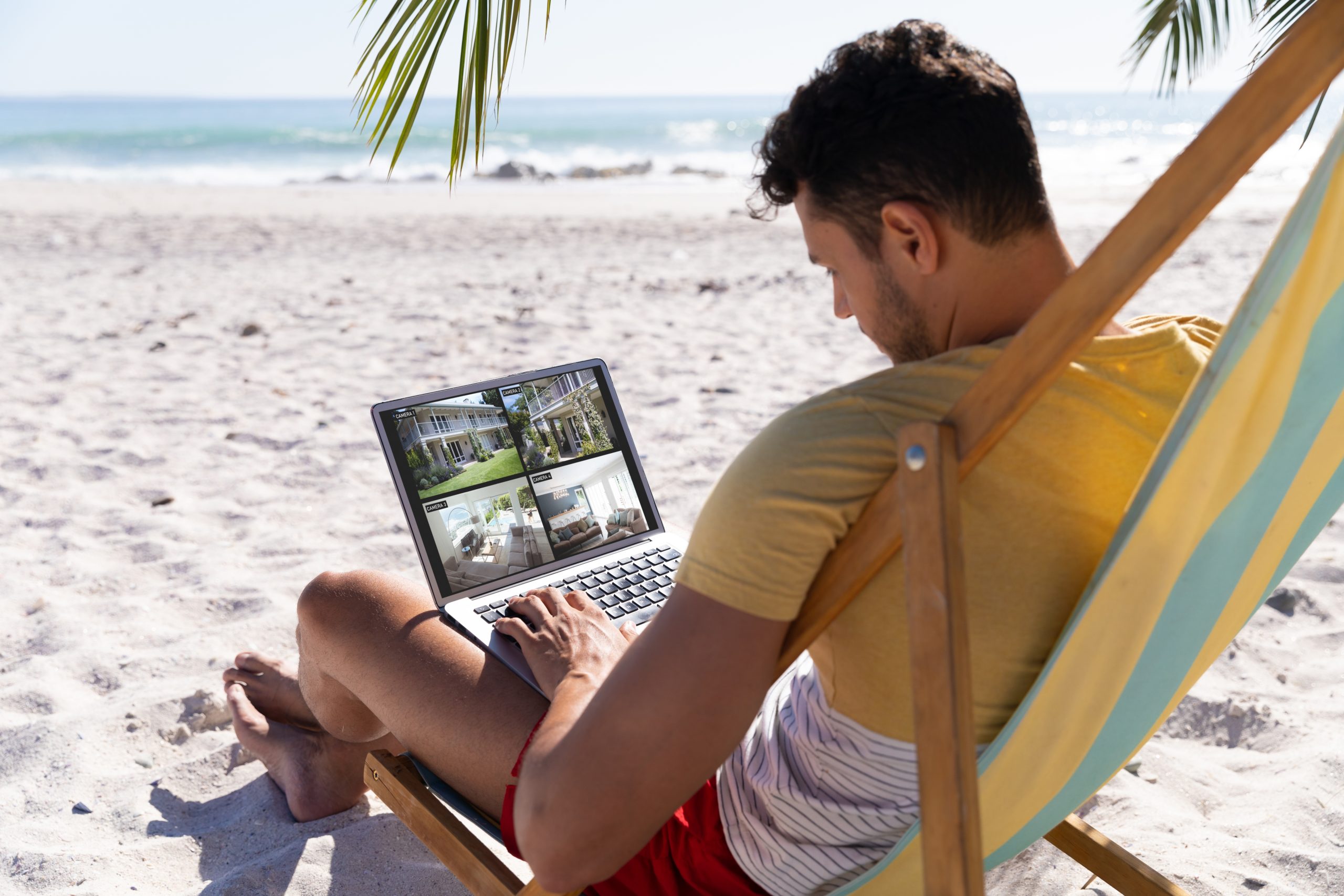 Man Checking Security Cameras While Away From Home